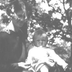 My mother holding me in a park when I was a baby