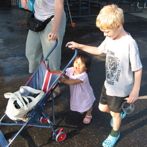 Angie pushing her stroller with Dante