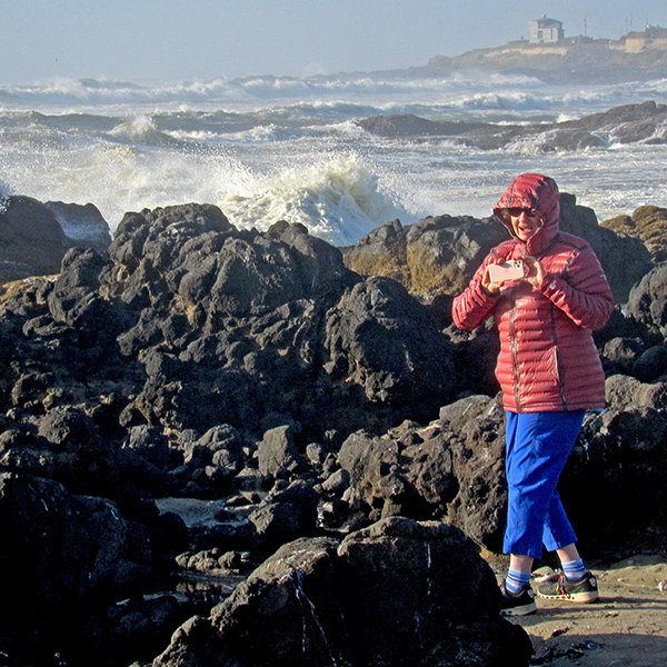 Mom out on the rocks to admire the waves.