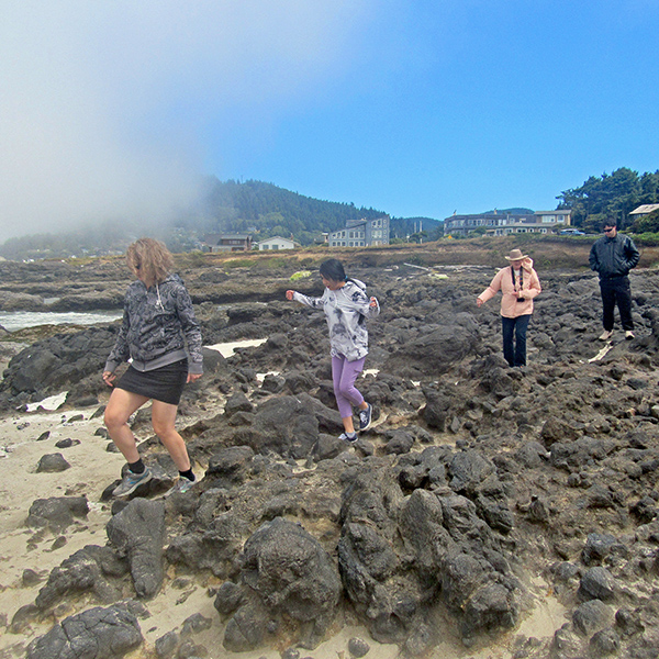 Jennell, Angie, Mom, and Sebastian on the rocks.