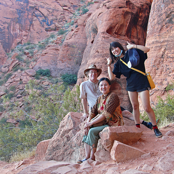 Posing above the slot canyon: Eric, Jeri, and Hsiao-Chi