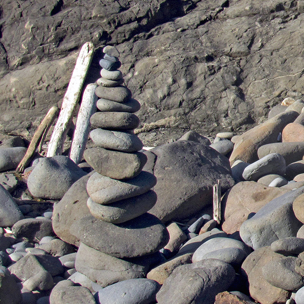 Stones carefully stacked on the coast in Yachats.