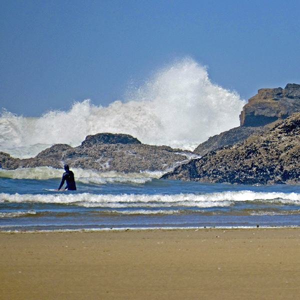 A single surfer at Yachats Beach.