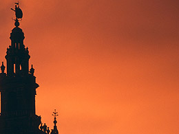 The Giralda of the Seville Cathedral and red clouds