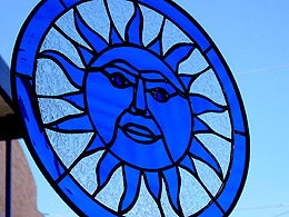 A blue sun made of stained glass for sale in Tijuana.