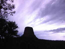 Devils tower with dramatic storm clouds