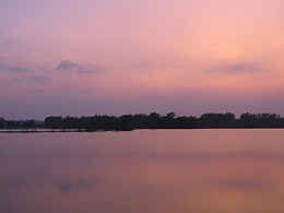 Flooded Illinois land at sunset, near Burlington, Iowa