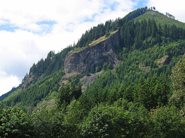 Mountains and a rock outcrop that looks like a stump