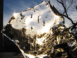 The setting sun on the last day of December 2004 shines through a sheet of ice