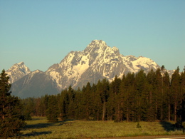 A warm early dawn light on Grand Teton