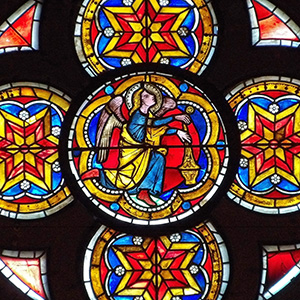 Angel with censor An angel with a blue robe and yellow coat holds a censor with insense while kneeling and looking up toward Christ