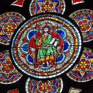 Christ Pantocrator Christ wears yellow and green, and sits on a throne.