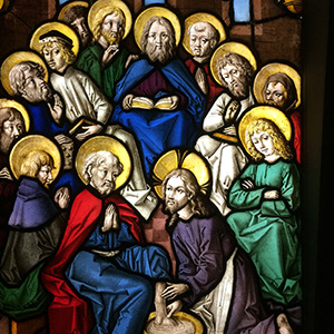 Service with humility, as He taught us The disciples are arranged in a circle. Rather than Jesus being at the top of the circle, he kneels at the lowest part of the circle, and kneels before one of his disciples, washing the disciple's feet in a bowl of water.