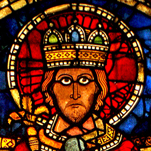 King Enthroned a king with a serious expression stares out. He is majestic, and seems to be powerful and glorious.