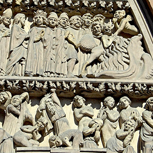figures on the cathedral take dramatic poses as they are called forward for judgment, and other figures have been split into two groups, one headed toward hell, and the other protected from hell.