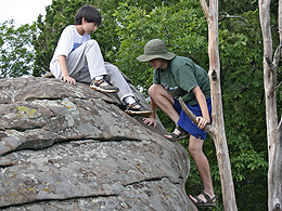 Sebastian climbing up a stone.