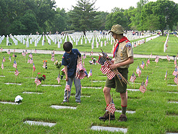 Putting flags out at Camp Butler Cemetery.