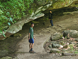 Sebastian and Arthur on a trail along a rock face