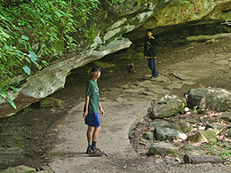 Sebastian and Arthur on a trail along a rock face