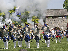 Historical re-enactment of musket firing.