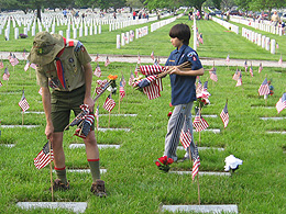 Putting flags out at Camp Butler Cemetery.