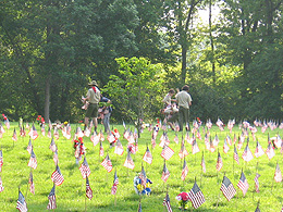 Putting flags out at Camp Butler Cemetery.