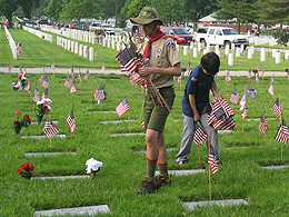 Putting flags out at Camp Butler Cemetery.