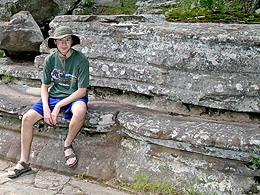 Sebastian sitting on a natural stone shelf at Garden of the Gods.