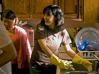 Jeri washing dishes in the Bisharat kitchen