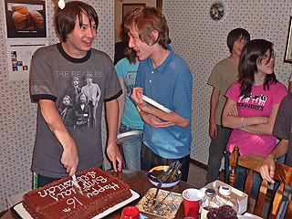 Sebastian cuts his birthday cake