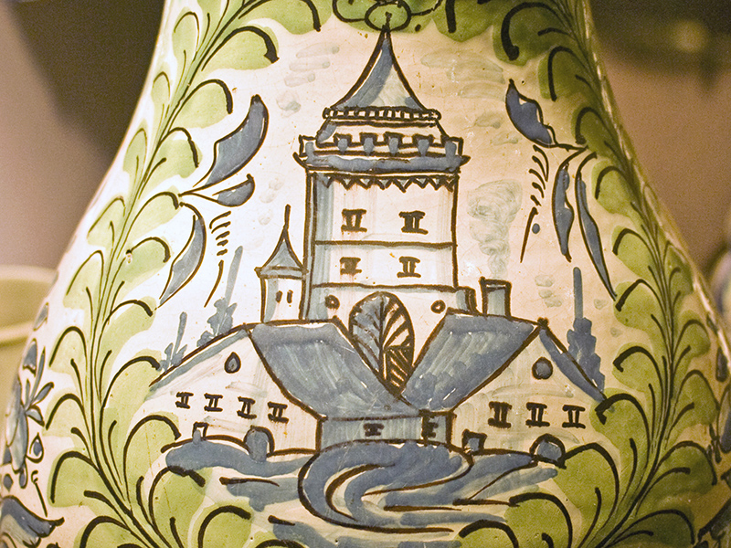 pottery design of houses and a castle tower