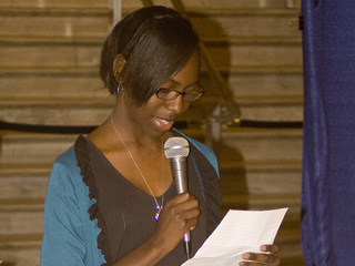 Winner of the essay contest reads at the Race Unity festival