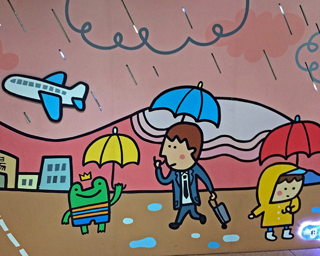 Holding umbrella murals in transit station