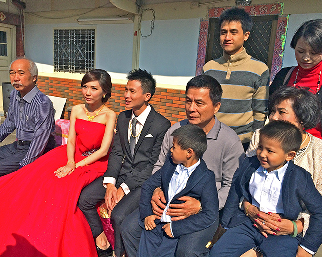 Family seated outdoors