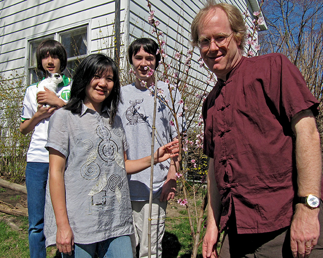 Hadley-Ives family by our peach tree on the occasion of Arthur’s 14-year-old birthday