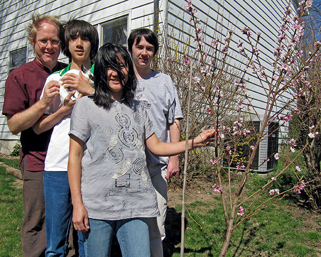 Hadley-Ives family by our peach tree on the occasion of Arthur’s 14-year-old birthday