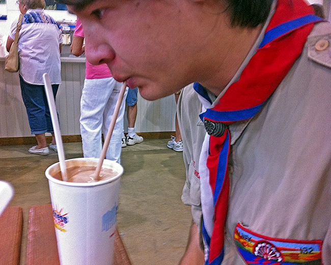 Sebastian drinks a milkshake at the State Fair