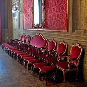Chairs in old palace, Bologna, Italy