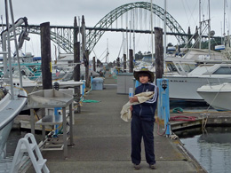 Arthur holds the salmon wrapped up in an old shirt rag