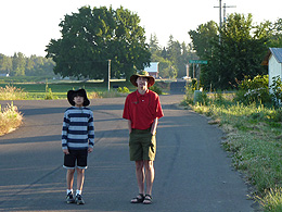 Arthur and Sebastian standign on a farm road