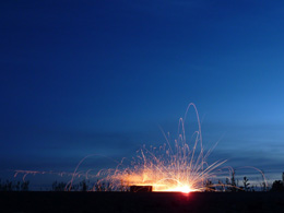 Sparks in and the blue of late twilight
