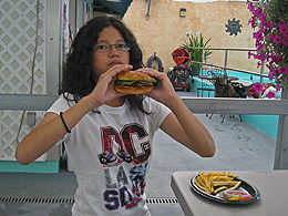 Teresa with a hamburger