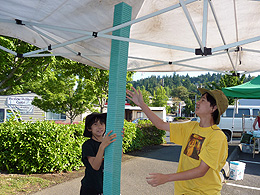 A tower of small fruit baskets is perhaps nearly eight feet high