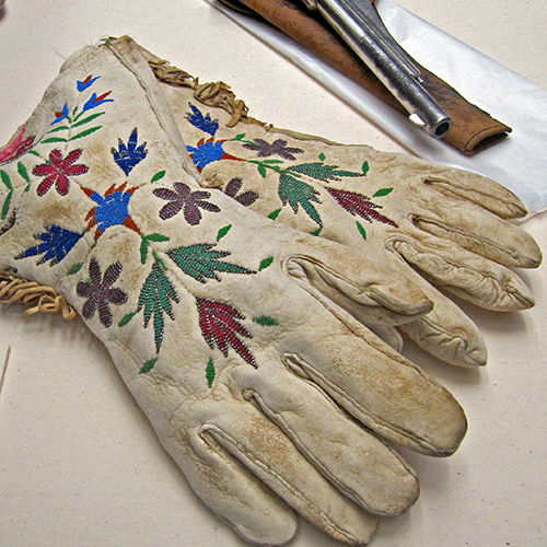 Gloves with colorful beads in floral and plant patterns