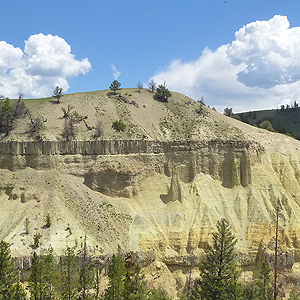 Band of pillars in cliff face