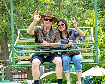 Eric and Jeri wearing dark glasses on ski lift