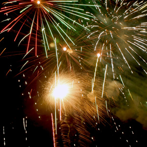 Fireworks bursting in air with a bright blast