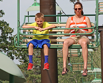 Mother and son on ski lift ride