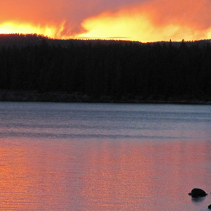 Sunset in clouds looks like fire over West Thumb