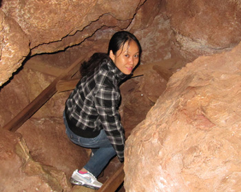 Xiuli heading down a path in the cave